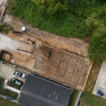Aerial view of a construction site breaking ground on Boy Street